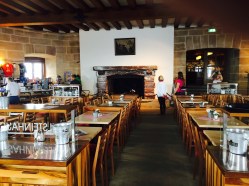 The fireplace given by Mussolini is at the head of the conference room, today a restaurant